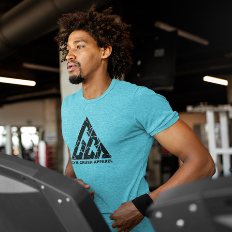 Man on treadmill wearing a light blue t shirt with company logo 